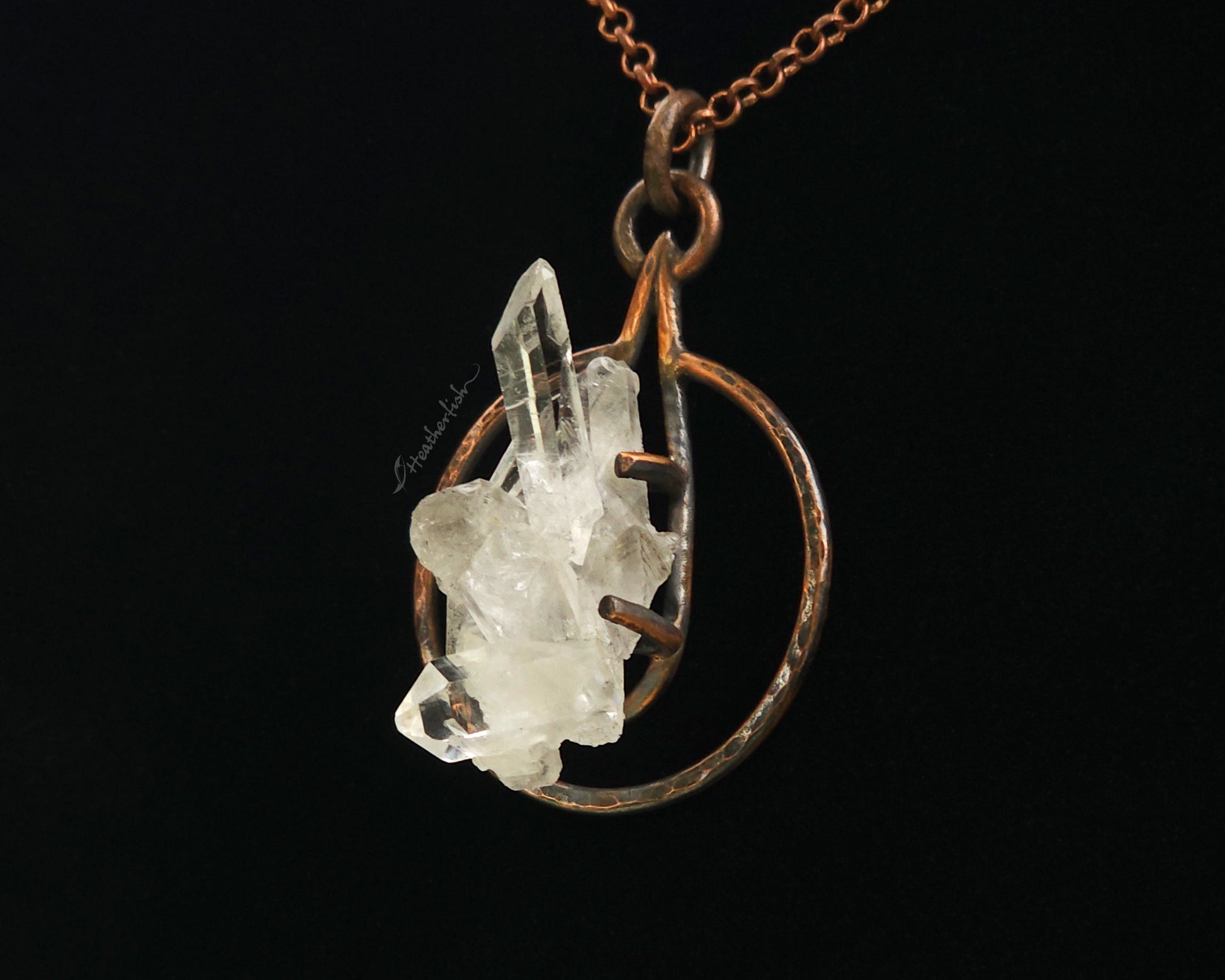 Crystal pendant necklace on a black background