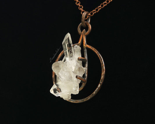 Crystal pendant necklace on a black background