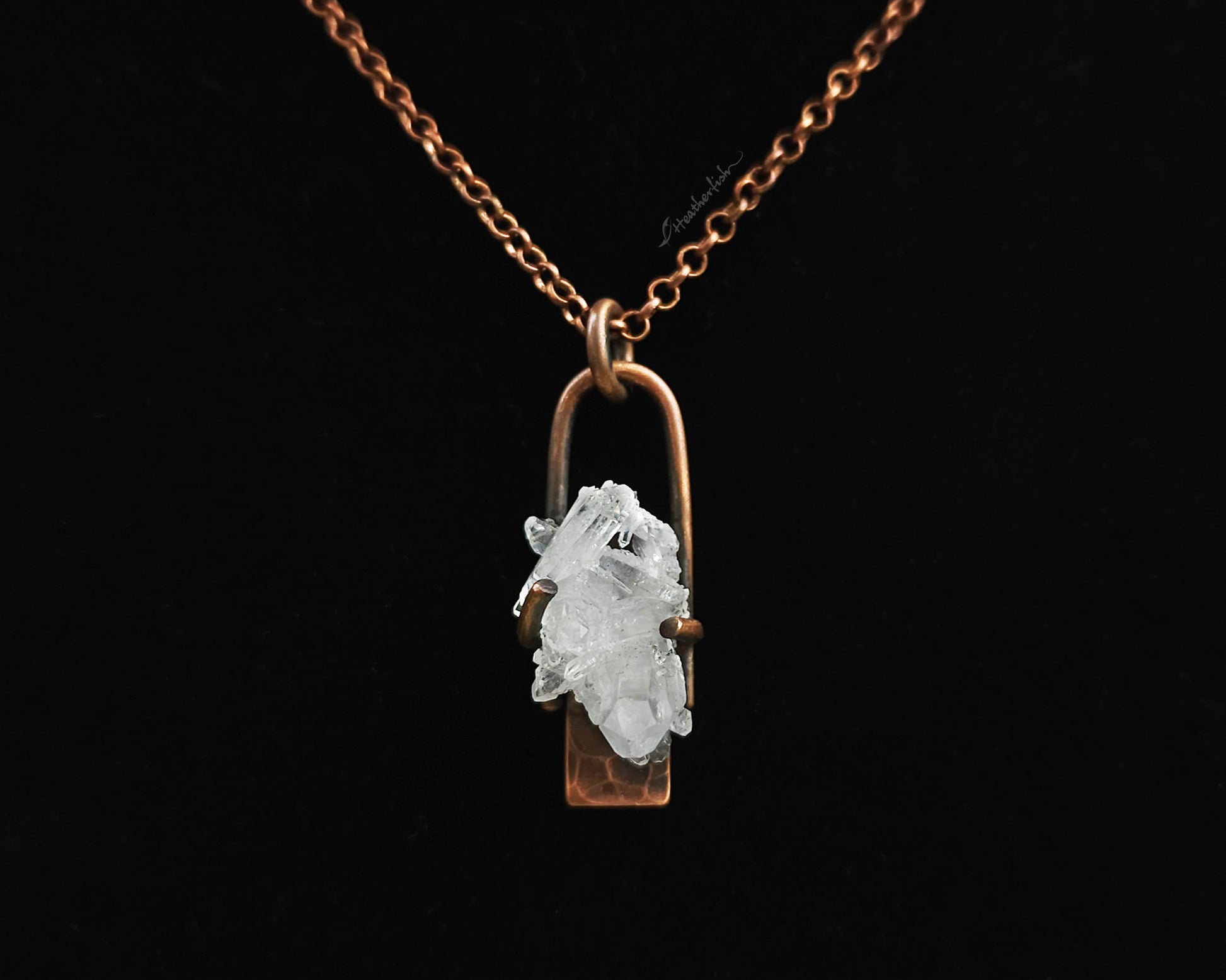 Quartz Cluster Necklace with copper chain against a black background.