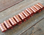 A roll of Copper Dread Beads Set of 10