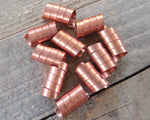 A close up top view of Copper Dread Beads Set of 10