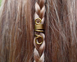 Set of 5 filigree beads on braided hair.