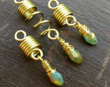 Light Blue, Gold Loc Beads, Set of 3 displayed on painted wood background.