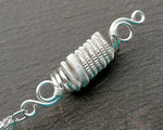 Close up of the woven coil on the double quartz dread bead.