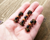 A top view of Diffuser Dread Bead Set of 3 in hand.