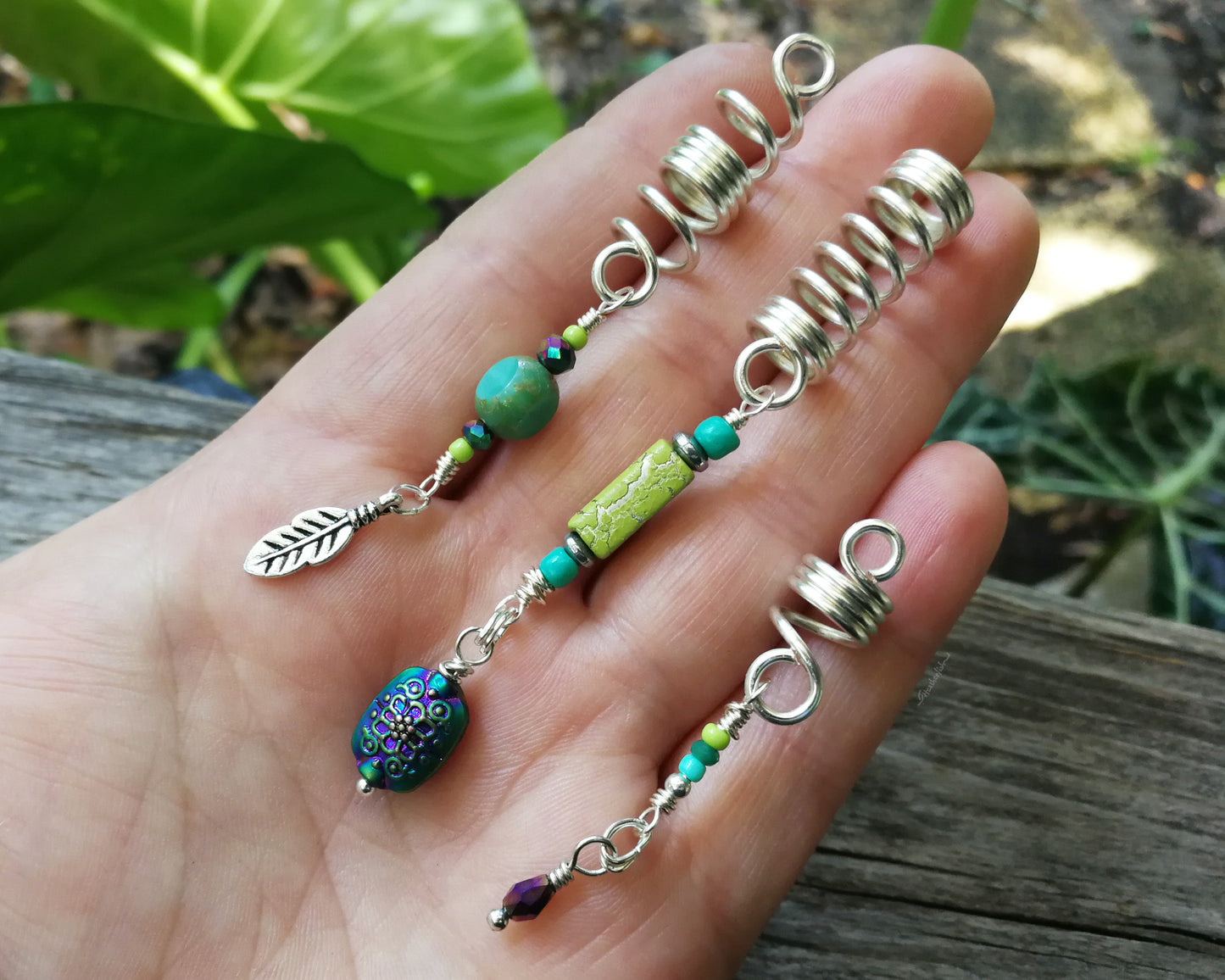 A top view of Heatherfish Signature Dread Beads Set of 3 in hand.