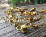 A side view of a Set of 5 Gold Amber Loc Beads.