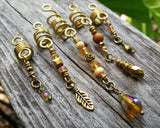 A close up view of a Set of 5 Gold Amber Loc Beads.
