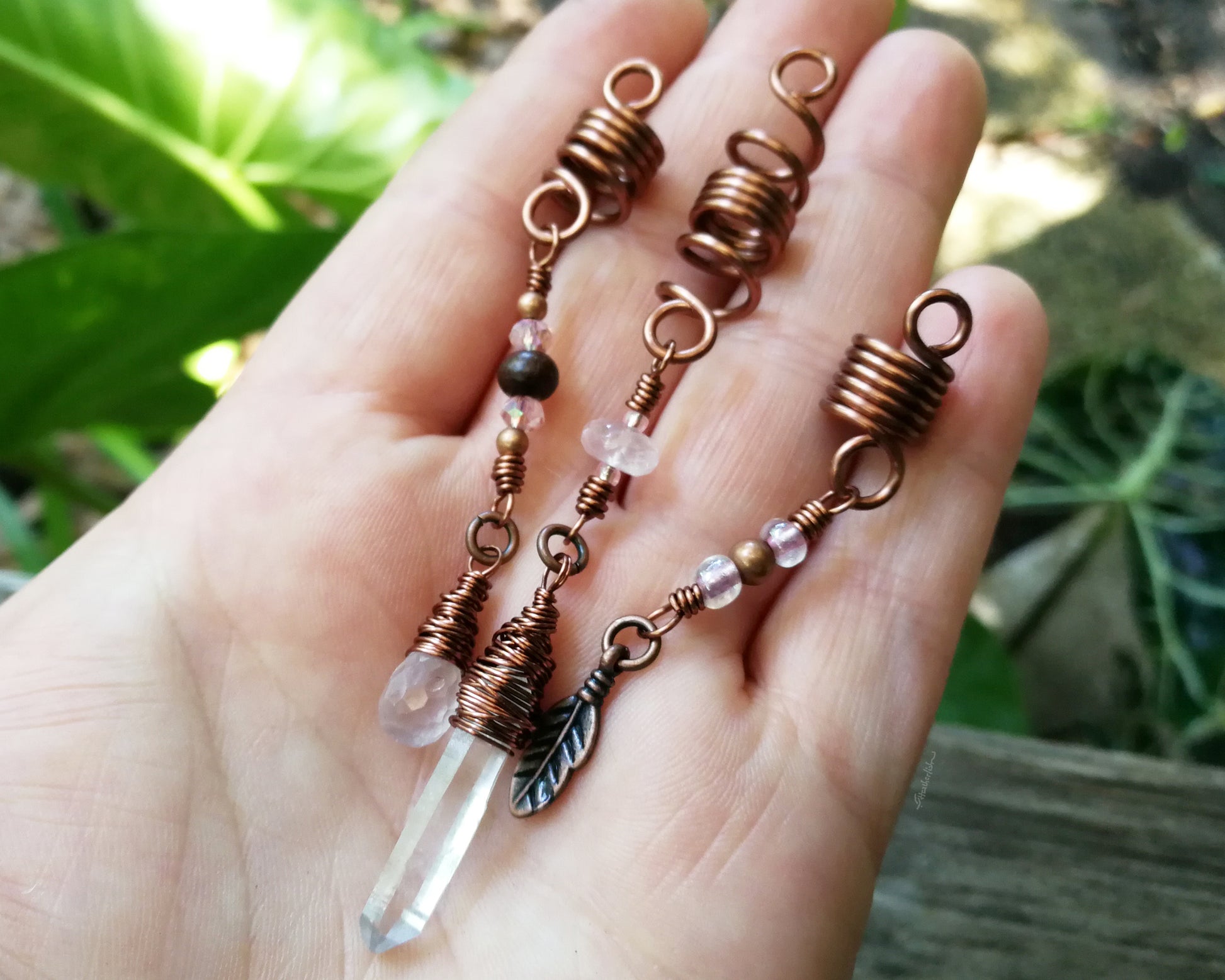 A top view of Rose Quartz Loc Beads Set of 3 in hand.