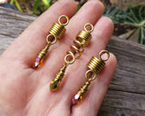 Amber and gold dread bead set of 3 in hand
