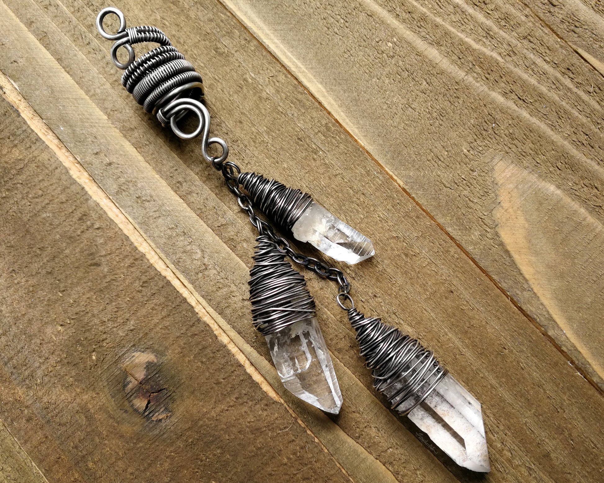 Silver Crystal Dread Bead, Ivory Inclusions on wood background.