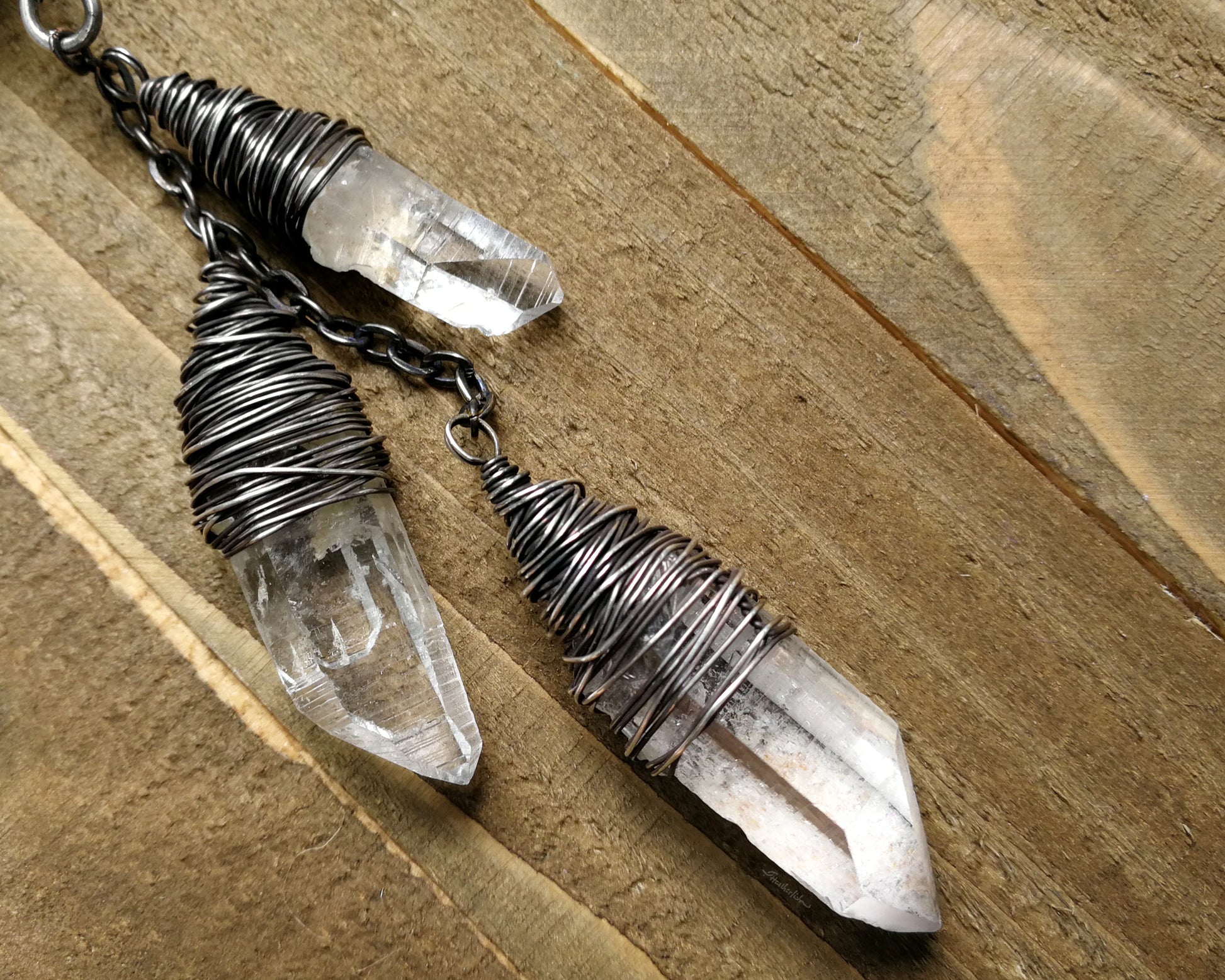 Close up of crystals with Ivory Inclusions on wood background.
