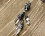 Silver Crystal Dread Bead, Ivory Inclusions on wood background.