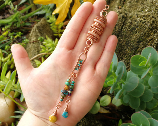 Yellow Jasper, Turquoise Dread Bead held in hand to show scale.