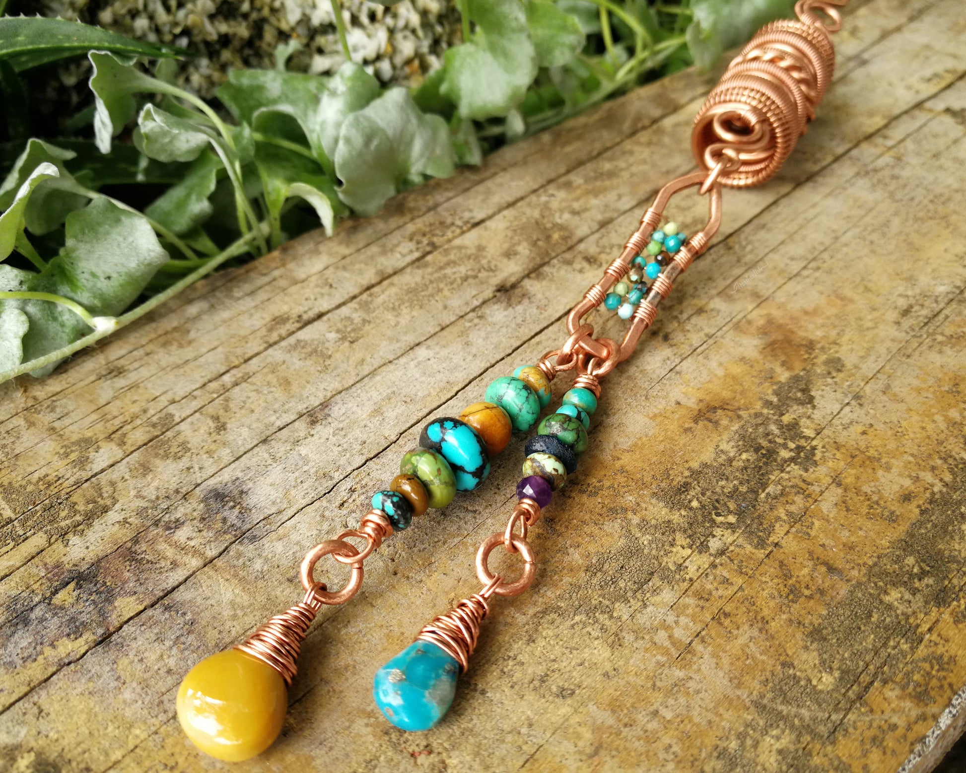 Yellow Jasper, Turquoise Dread Bead on a wood background.