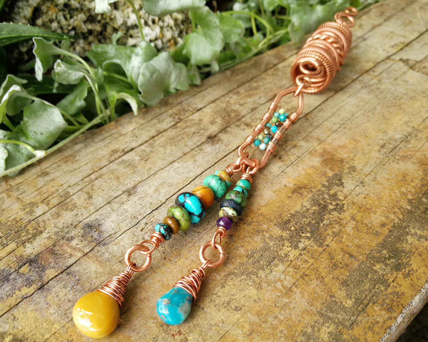 Yellow Jasper, Turquoise Dread Bead on a wood background.