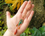 Bohemian copper loc bead featuring Ethiopian opal in a hand to show scale..