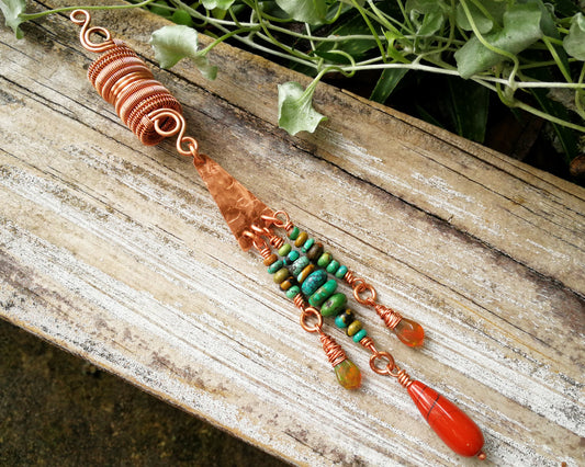 Bohemian copper loc bead featuring Ethiopian opal on a wood backdrop.
