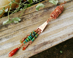 Bohemian copper loc bead featuring Ethiopian opal on a wood backdrop.