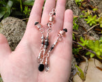 Rose Gold Black Loc Beads, Set of 3, held in hand to show scale.