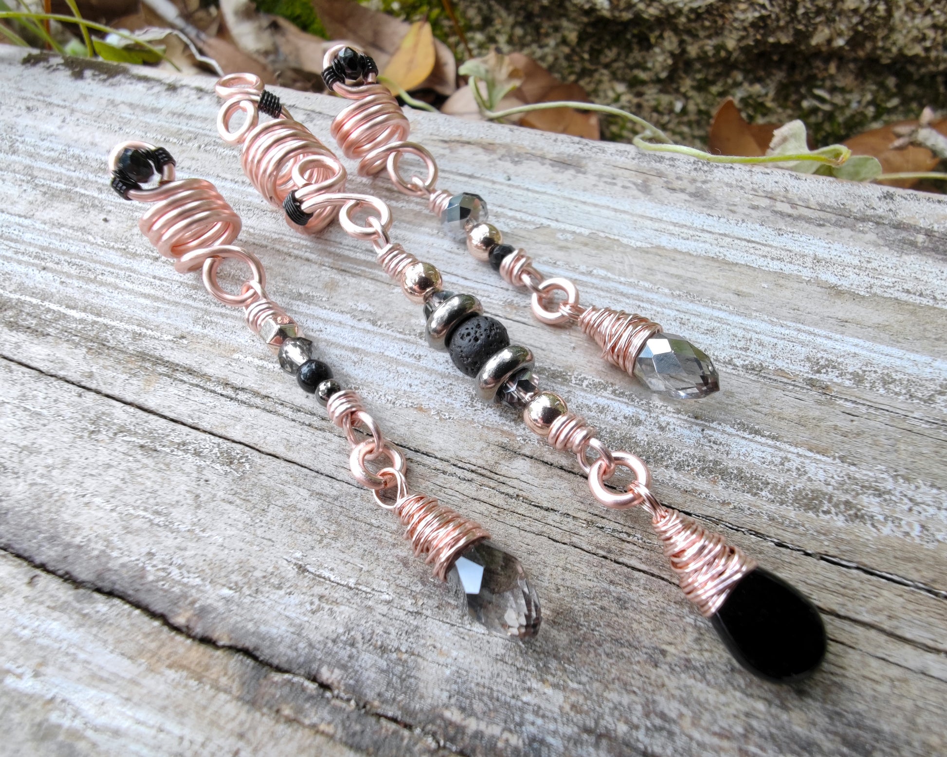 Rose Gold Black Loc Beads, Set of 3, on wood background.