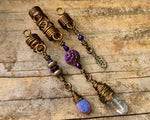 Quartz Set of 3 Dread Beads, antique brass color option, on a wood background.