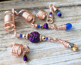 Rose Gold purple Loc Beads, Set of 4 on a wood background.