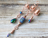 Rose Gold Rainbow Loc Beads Set on a wood background.
