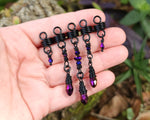 Purple and Black Loc Beads, Set of 5 held in hand to show scale.