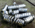 Set of 10 stylized aluminum dread beads in a pile