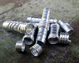 A side view of Stylized Dread Beads Set of 10.