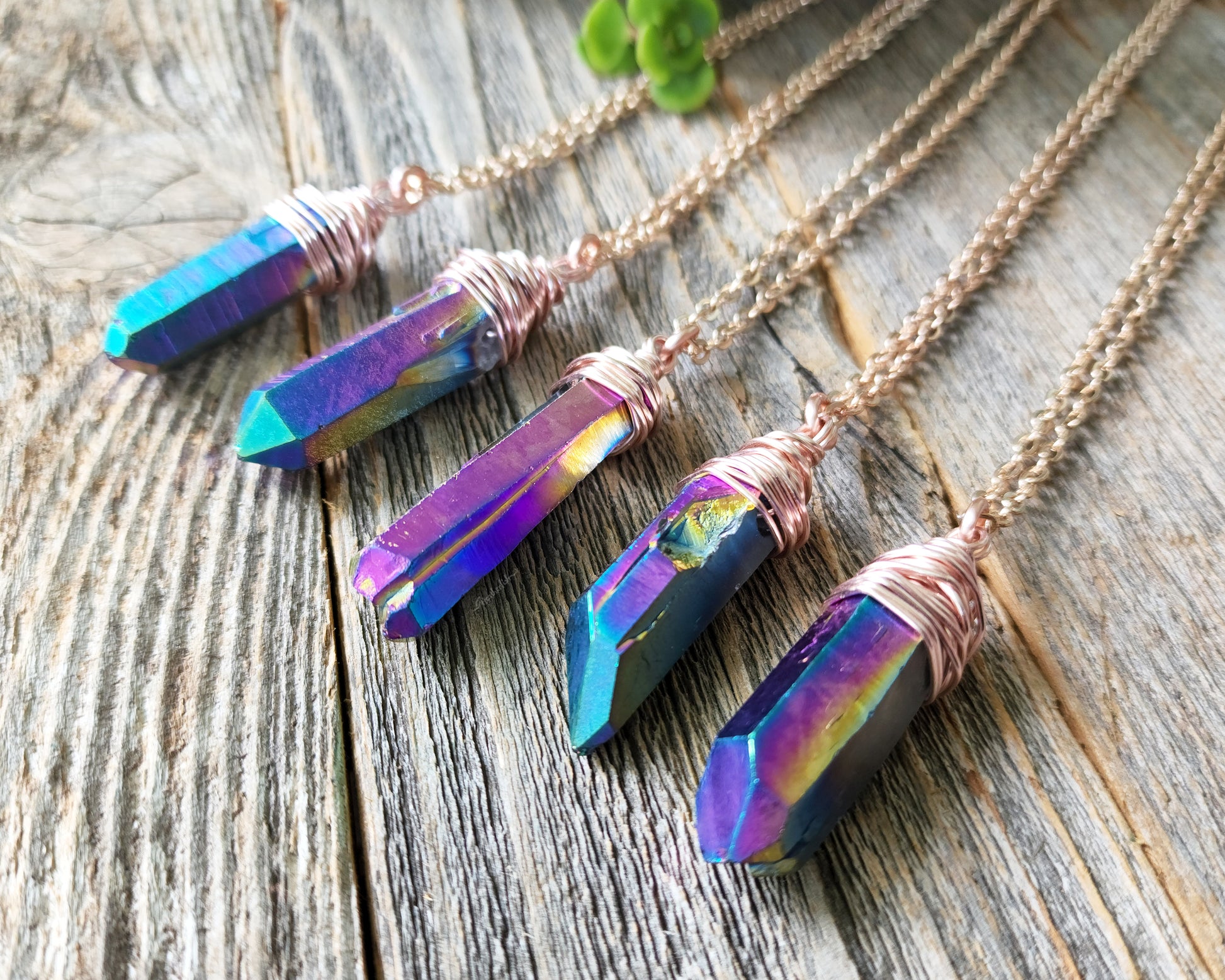 Chunky Rainbow Titanium Quartz Necklace on a wood background.