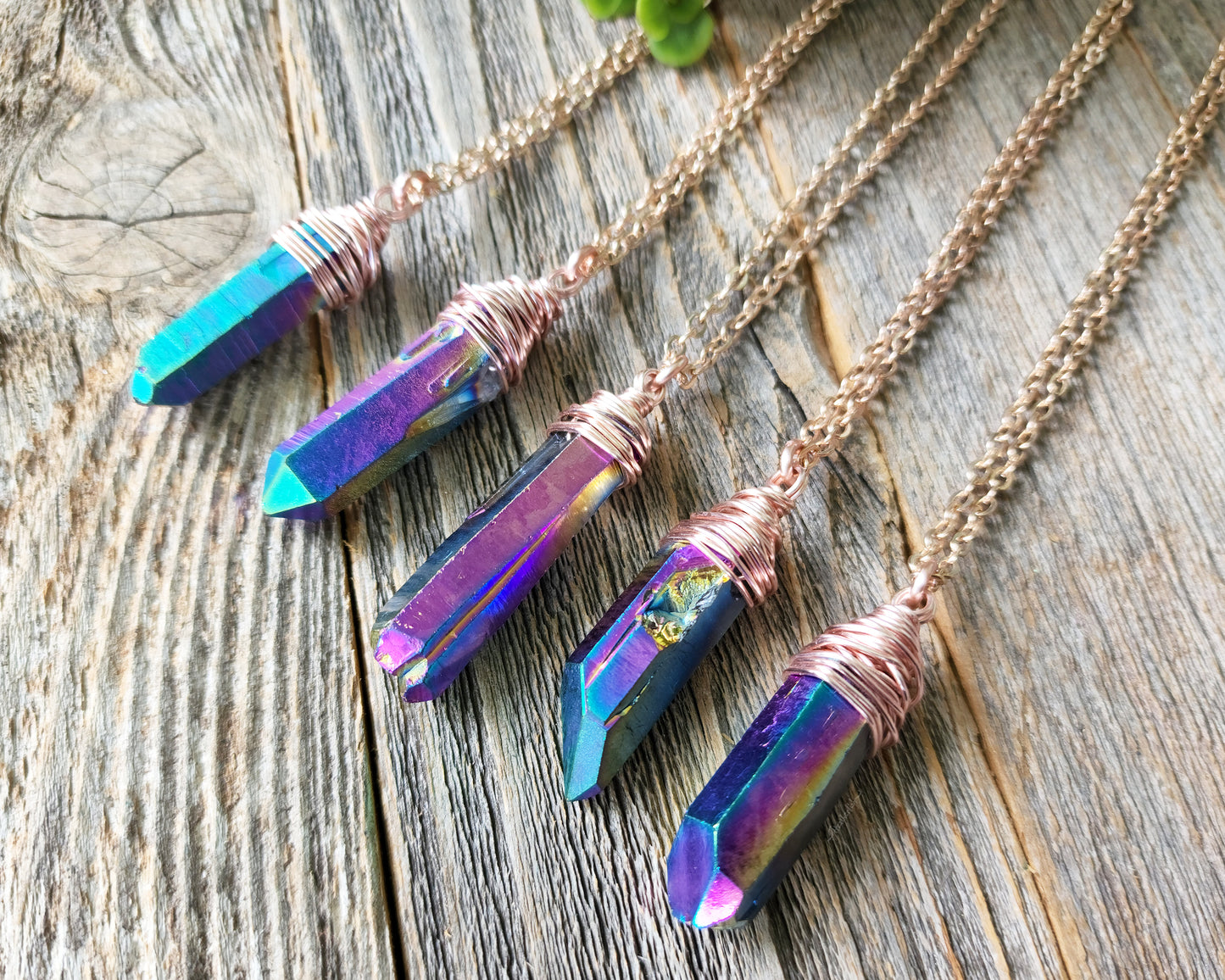 Chunky Rainbow Titanium Quartz Necklace on a wood background.