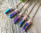 Chunky Rainbow Titanium Quartz Necklace on a wood background.