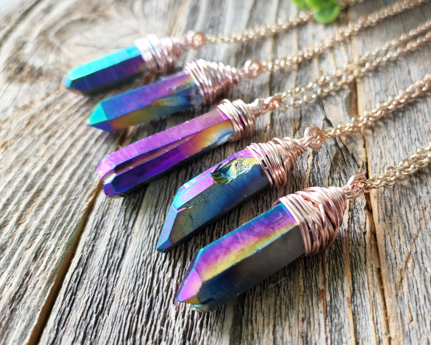 Chunky Rainbow Titanium Quartz Necklace on a wood background.