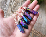Chunky Rainbow Titanium Quartz Necklace held in hand to show scale.