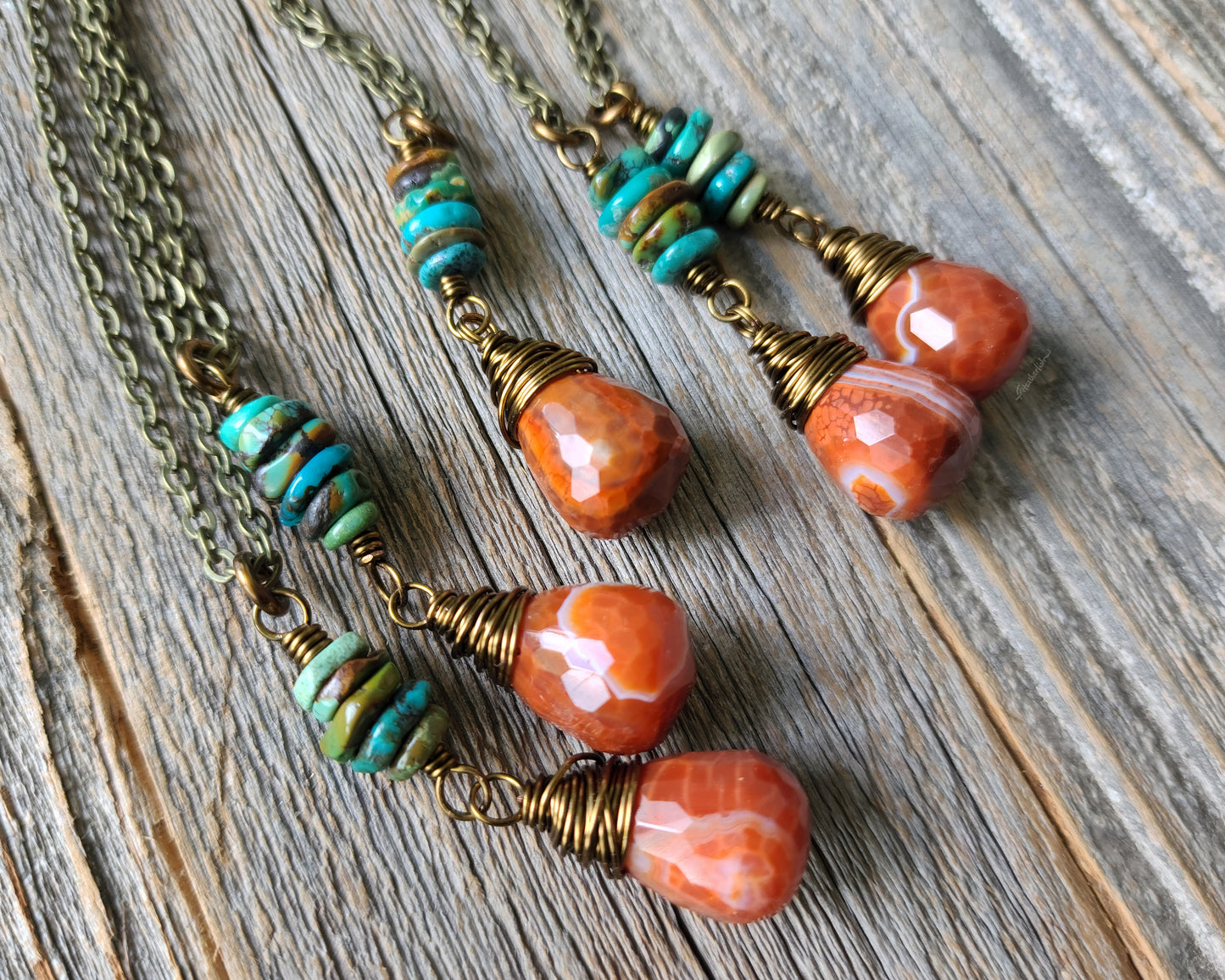 Fire Agate Hubei Turquoise Necklace on wood background.