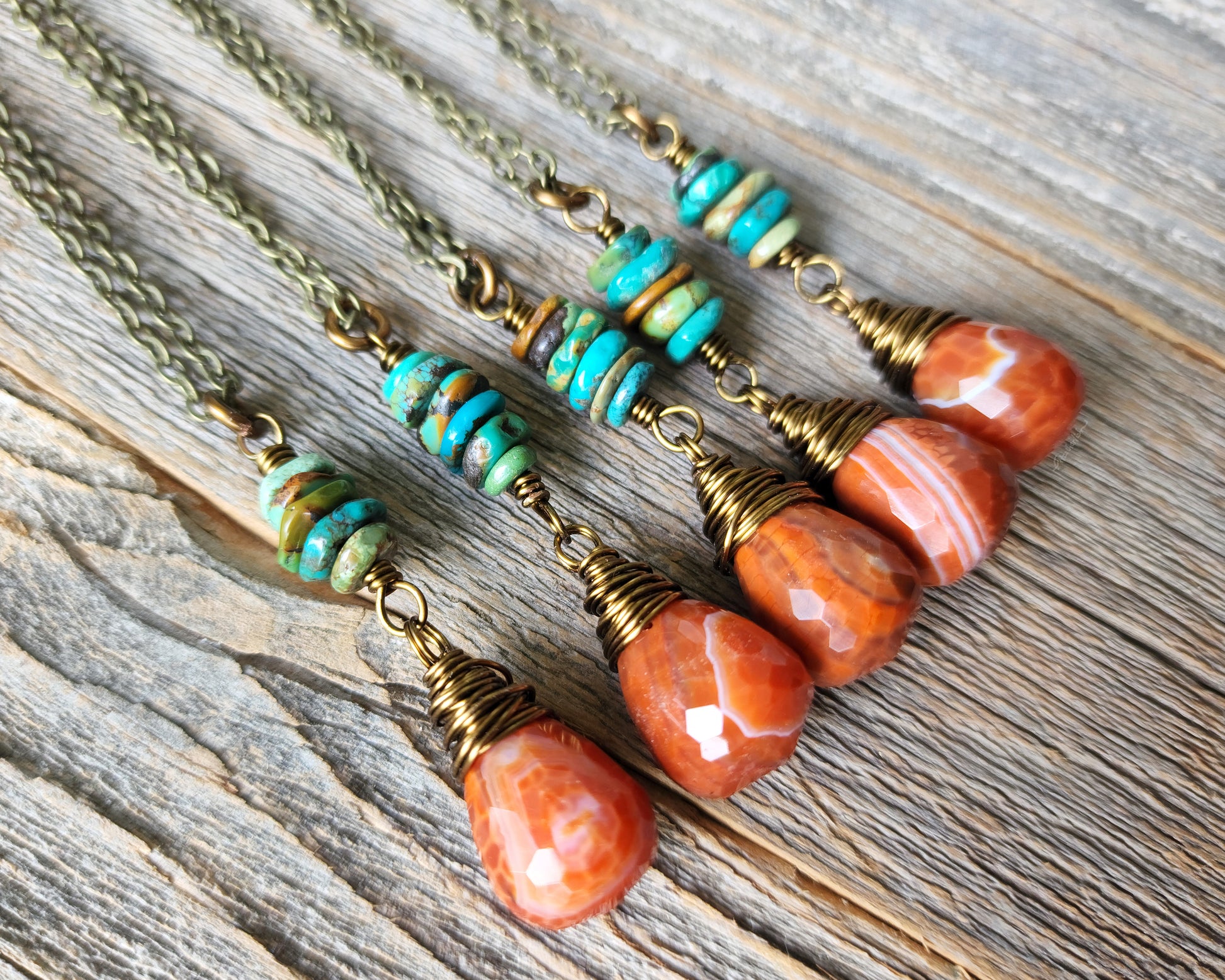 Fire Agate Hubei Turquoise Necklace on wood background.