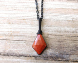 Rose Cut Red Jasper Necklace on a wood background.ac
