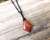 Rose Cut Red Jasper Necklace on a wood background.