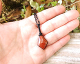 Rose Cut Red Jasper Necklace held in hand to show scale.