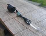 A close up of a Black Crystal Loc Bead.