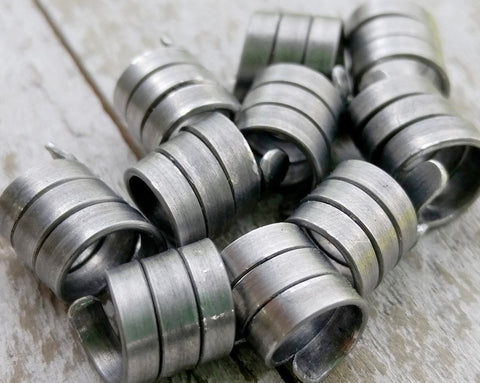 A close up view of Oxidized Aluminum Dread Beads Set of 10.