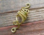 A back view of a Small Woven Brass Dread Bead.