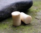 A side view of Handmade Antler Plugs.