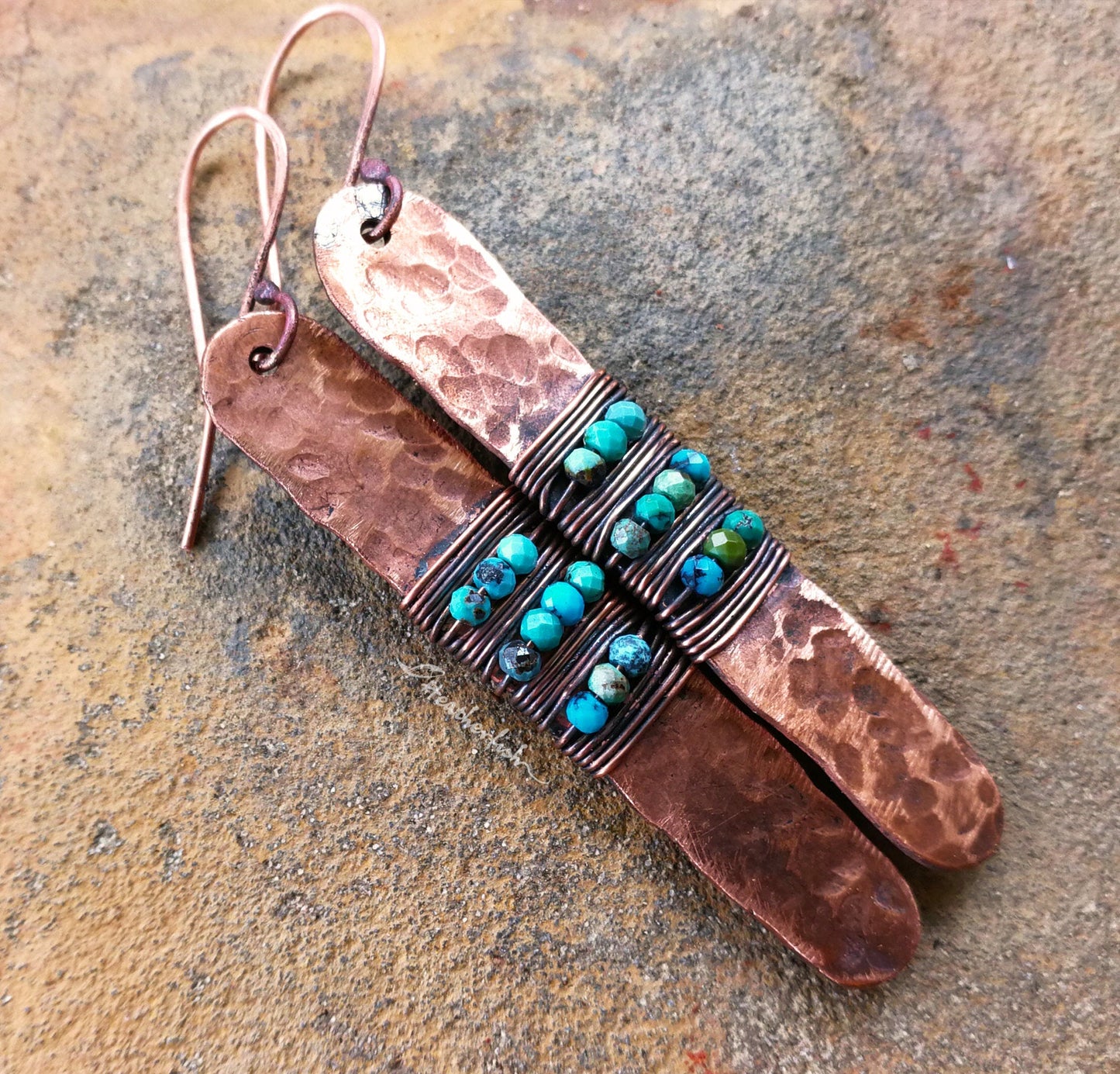 A top view of Turquoise Hammered Copper Earrings.