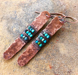 A top view of Turquoise Hammered Copper Earrings.