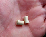 A top view of Handmade Antler Plugs in hand. 