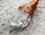 A close up view of a Woven Dread Bead with Arkansas Quartz.
