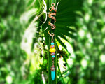 A display plant view of a Bohemian Style Loc Bead attached.